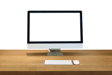 Modern personal computer on a wooden table with a white white screen for mock up and isolated white background.