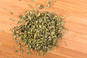 Handful of green dehydrated dried oregano herb