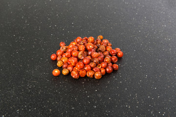 Handful of red spicy tiny round chile tepin peppers