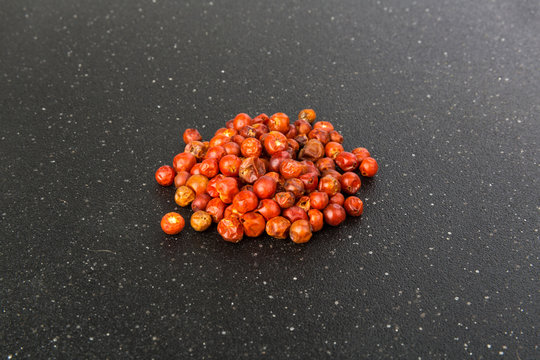 Handful of red spicy tiny round chile tepin peppers