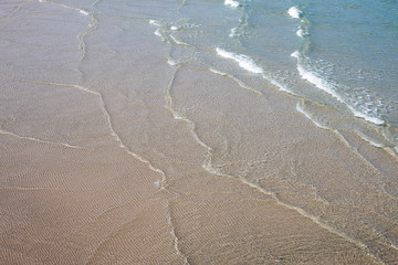 soft wave of the sea on the sandy beach.