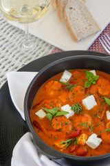 Shrimp with spicy tomato sauce, feta cheese and herbs