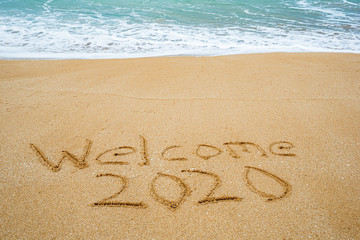 Welcome 2020 written in the sand- New Year’s concept