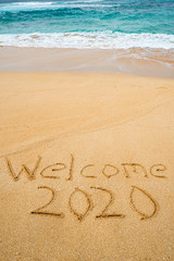 Welcome 2020 written in the sand- New Year’s concept