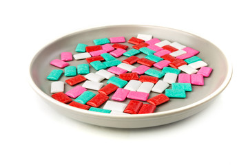 Red green pink and white assorted flavors chicle gum pieces