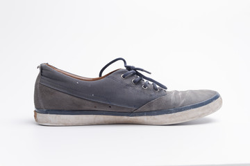 old dirty sneakers left isolated