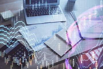 Financial graph colorful drawing and table with computer on background. Double exposure. Concept of international markets.