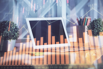 Double exposure of chart and financial info and work space with computer background. Concept of...
