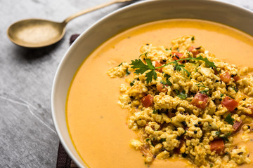 Paneer Bhurji Gravy served in a bowl. selective focus