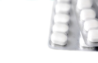 White pills. Blister. Packing pills. Allergy. Disease. Health. Medical treatment.