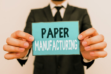 Writing note showing Paper Manufacturing. Business concept for company that use wood as raw material and produce paper Male human wear formal work suit with office look hold book