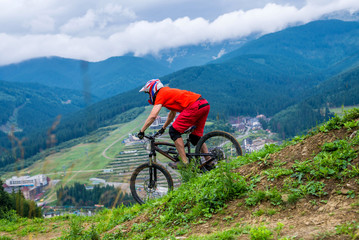 Professional athlete ride on a mountain bike.