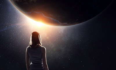 Girl looking at Earth planet