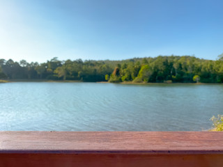 Obraz premium Empty wooden bar with blurred river and nature background.