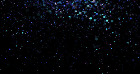 Flying dust particles on a black background
