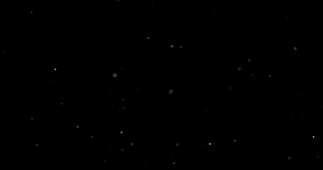 Flying dust particles on a black background
