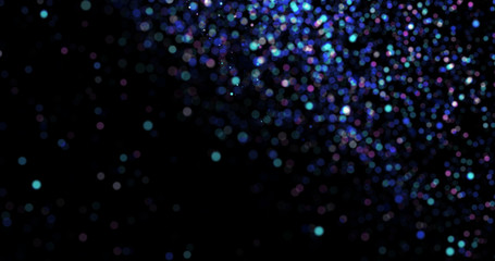 Flying dust particles on a black background