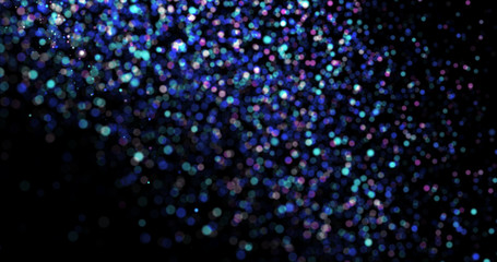 Flying dust particles on a black background