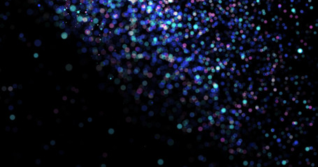 Flying dust particles on a black background