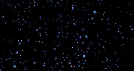 Flying dust particles on a black background