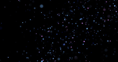 Flying dust particles on a black background