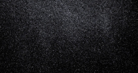 Natural white winter snowfall on a black background