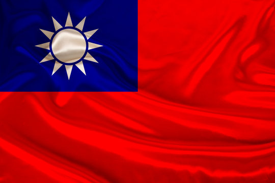 beautiful photo of the colored national flag of the modern Chinese Republic of Taiwan on textured fabric, concept of tourism, emigration, economics and politics, closeup - Powered by Adobe