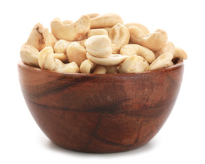 Bowl with cashew nuts on white background