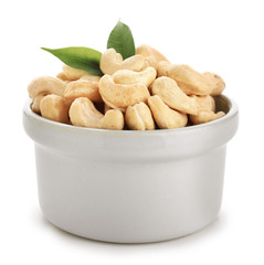 Bowl with cashew nuts on white background