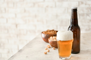Fresh beer and snacks on table