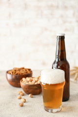Fresh beer and snacks on table