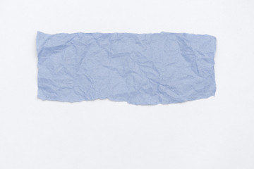 Abstract part of packaging craft wrinkled paper toned in lighttrendy color 2020 classic blue on white background.