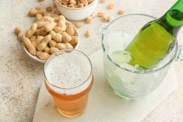 Fresh beer and snacks on table