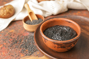 Bowl of tasty tahini on table
