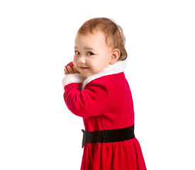 Cute little baby in Santa Claus costume and with Christmas ball on white background