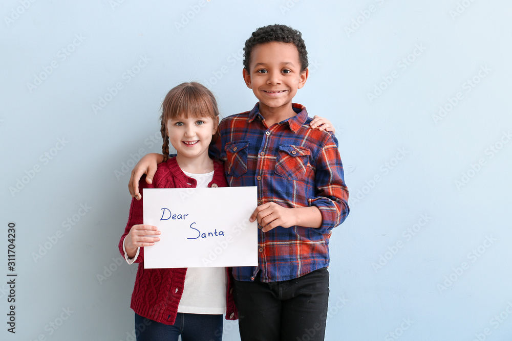 Wall mural cute little children with letter to santa claus on white background