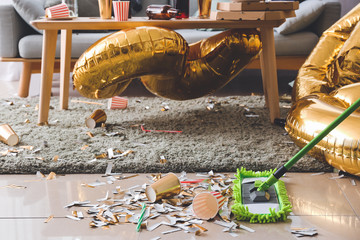 Cleaning of floor in room after New Year party