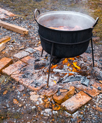 Romanian traditional food prepared at the cauldron on the open fire with wood, Christmas tradition