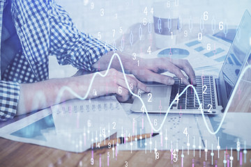 Multi exposure of stock market chart with man working on computer on background. Concept of financial analysis.