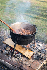 Romanian traditional food prepared at the cauldron on the open fire with wood, Christmas tradition