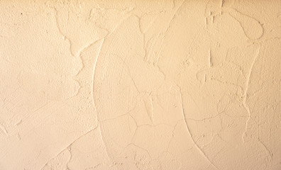 Cream and beige color of rough surface mortar concrete wall with random texture cement plaster masory man's work