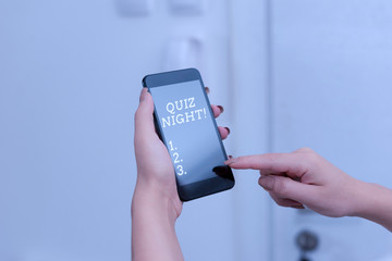 Handwriting text Quiz Night. Conceptual photo evening test knowledge competition between individuals woman using smartphone office supplies technological devices inside home