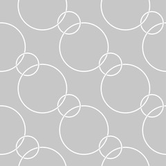 Geometric round print. White pattern on gray seamless background