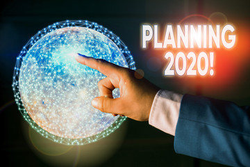 Conceptual hand writing showing Planning 2020. Concept meaning process of making plans for...