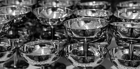 Fototapeta na wymiar silver cups stacked on each other in shelf at department stores