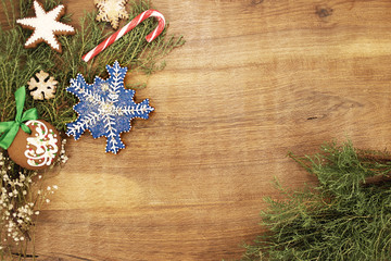 Christmas background with blue snowflake and spruce branches.