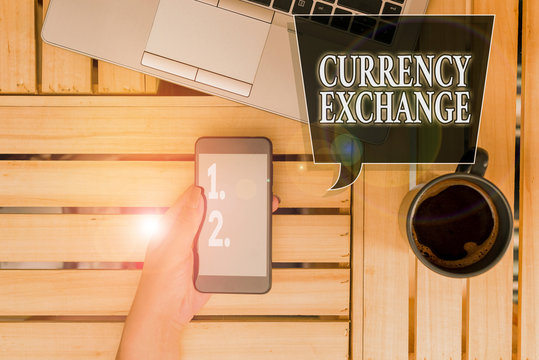 Handwriting text Currency Exchange. Conceptual photo rate at which one currency will be exchanged for another woman computer smartphone drink mug office supplies technological devices