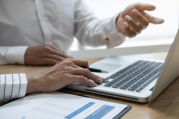 Fototapeta premium Business team brainstorming and discussing with financial data and report graph. Teamwork meeting working concept.