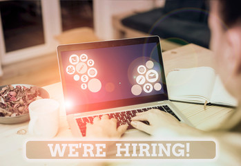 Conceptual hand writing showing We Re Hiring. Concept meaning recently employ someone or pay...