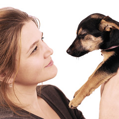 young girl holding a puppy